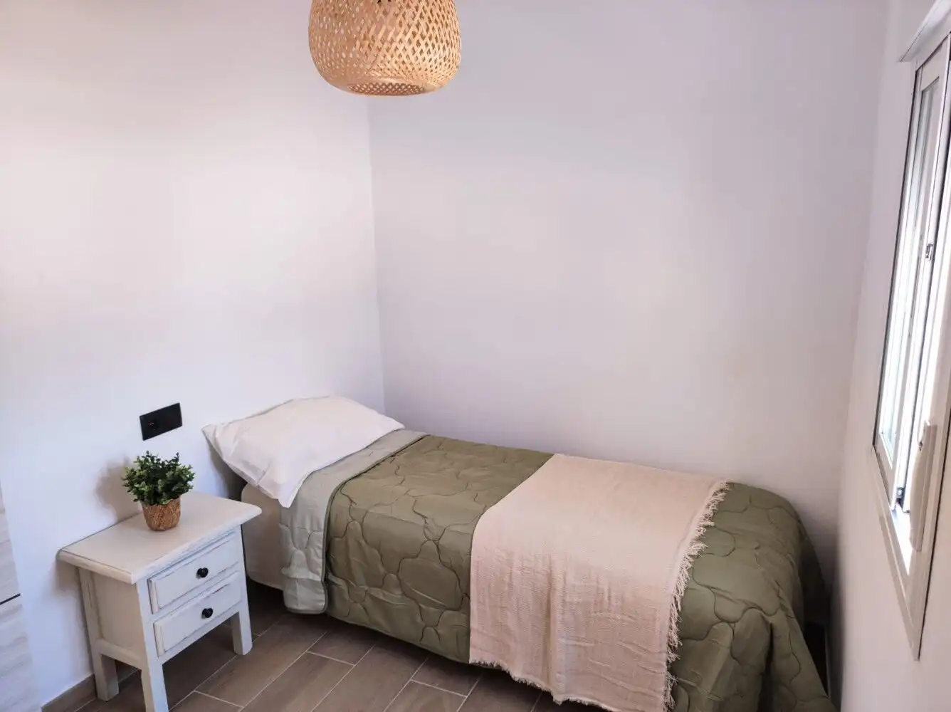 Bright bedroom with simple decor in Torresoto independent casita.