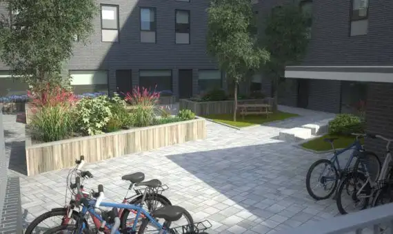 Student apartment courtyard in Sheffield with bikes and garden.
