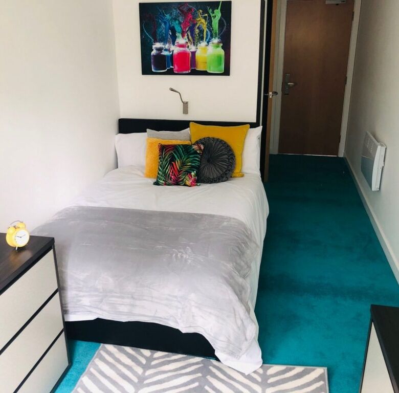 Modern student apartment in Sheffield with vibrant decor and cozy bedroom.