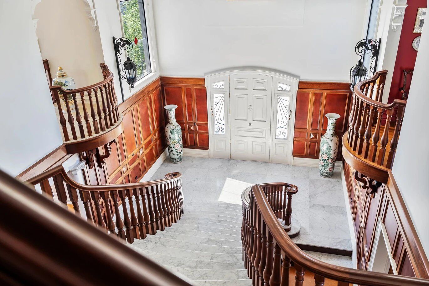 Elegant staircase and foyer of a luxury château in Ngararatunua, New Zealand.