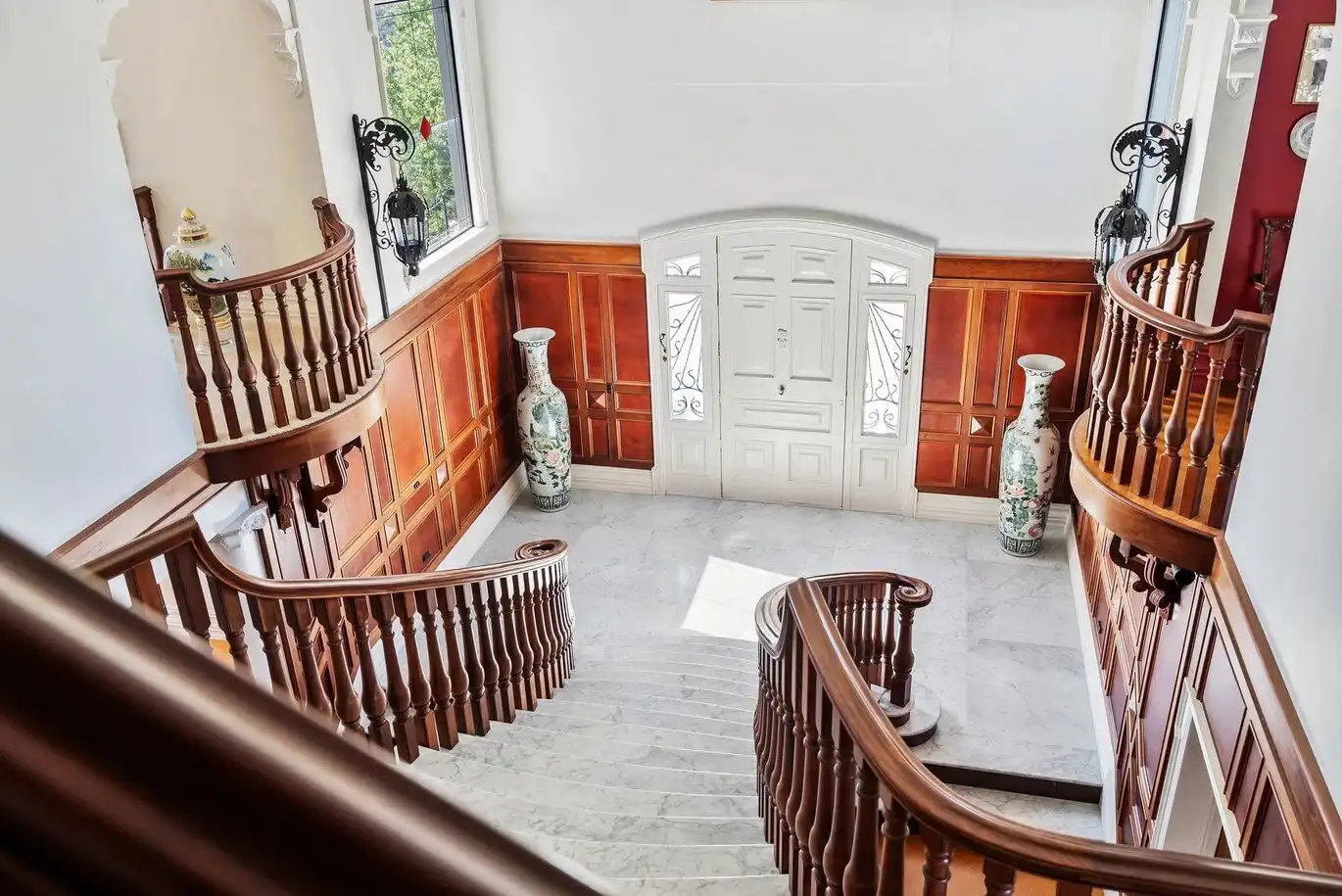 Elegant staircase and foyer of a luxury château in Ngararatunua, New Zealand.