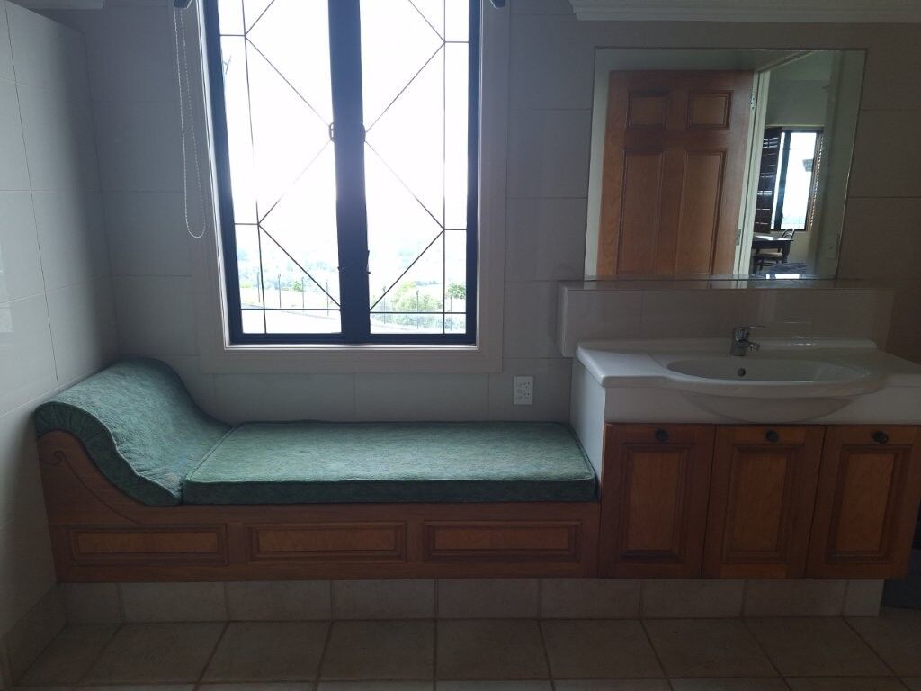 Château interior with window seat and bathroom vanity in Ngararatunua, New Zealand.
