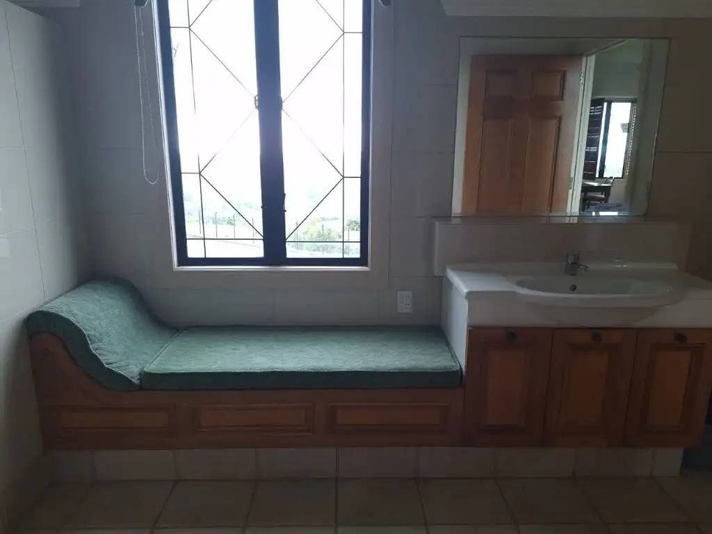 Château interior with window seat and bathroom vanity in Ngararatunua, New Zealand.