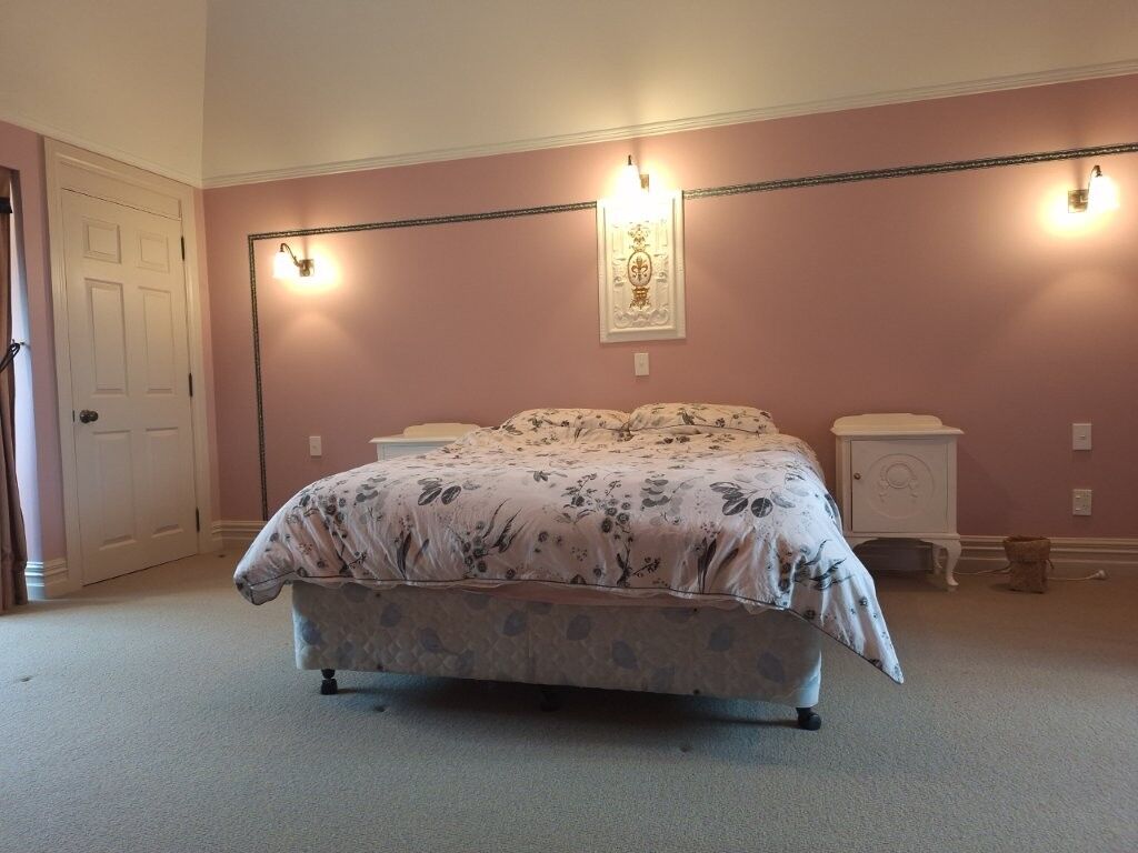 Elegant bedroom in Château Te Kamo, Ngararatunua, New Zealand.