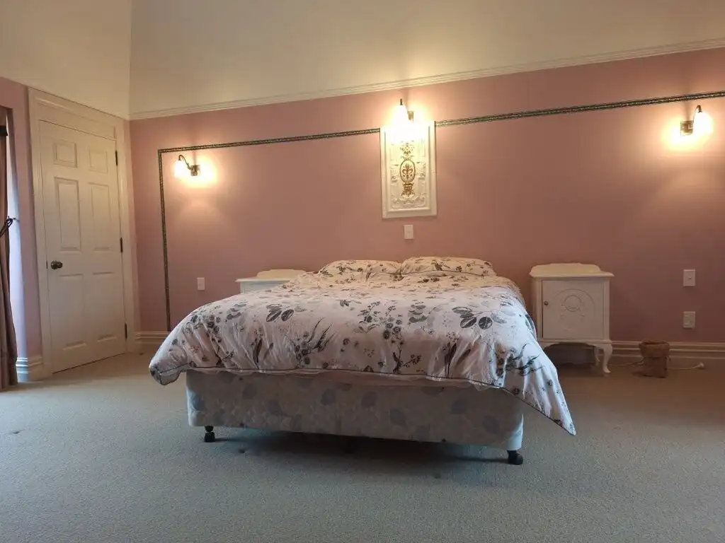 Elegant bedroom in Château Te Kamo, Ngararatunua, New Zealand.