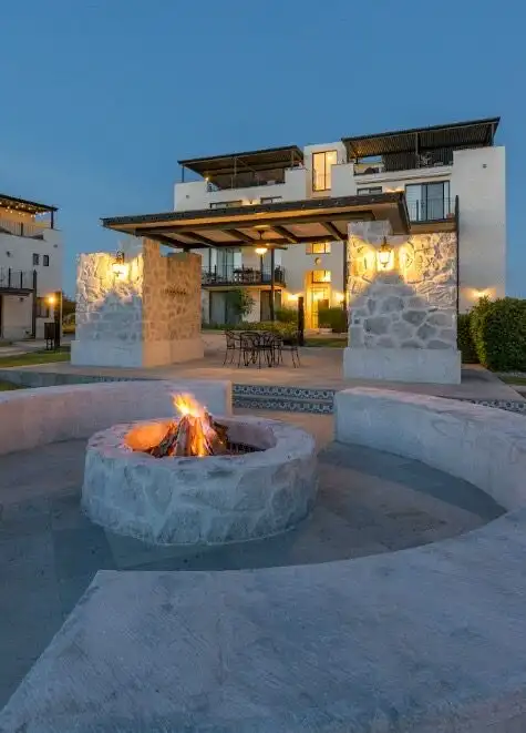 Beautiful exterior view of Casa Santa Elena in La Luminaria, featuring a heated pool, modern archite.