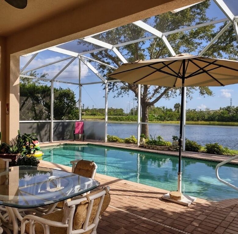 Waterfront villa with pool and outdoor seating in Cape Coral, Florida.