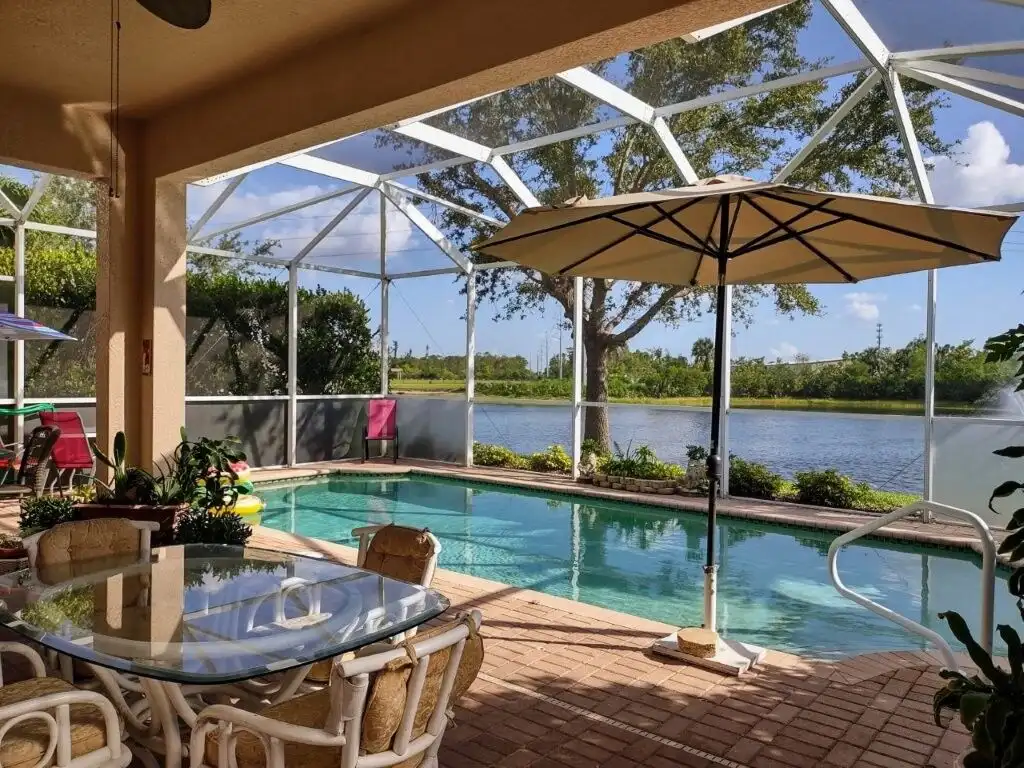 Waterfront villa with pool and outdoor seating in Cape Coral, Florida.