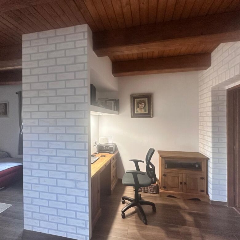 Interior view of a charming country home in Lukovištia, Rimavská Sobota, featuring a workspace and r.