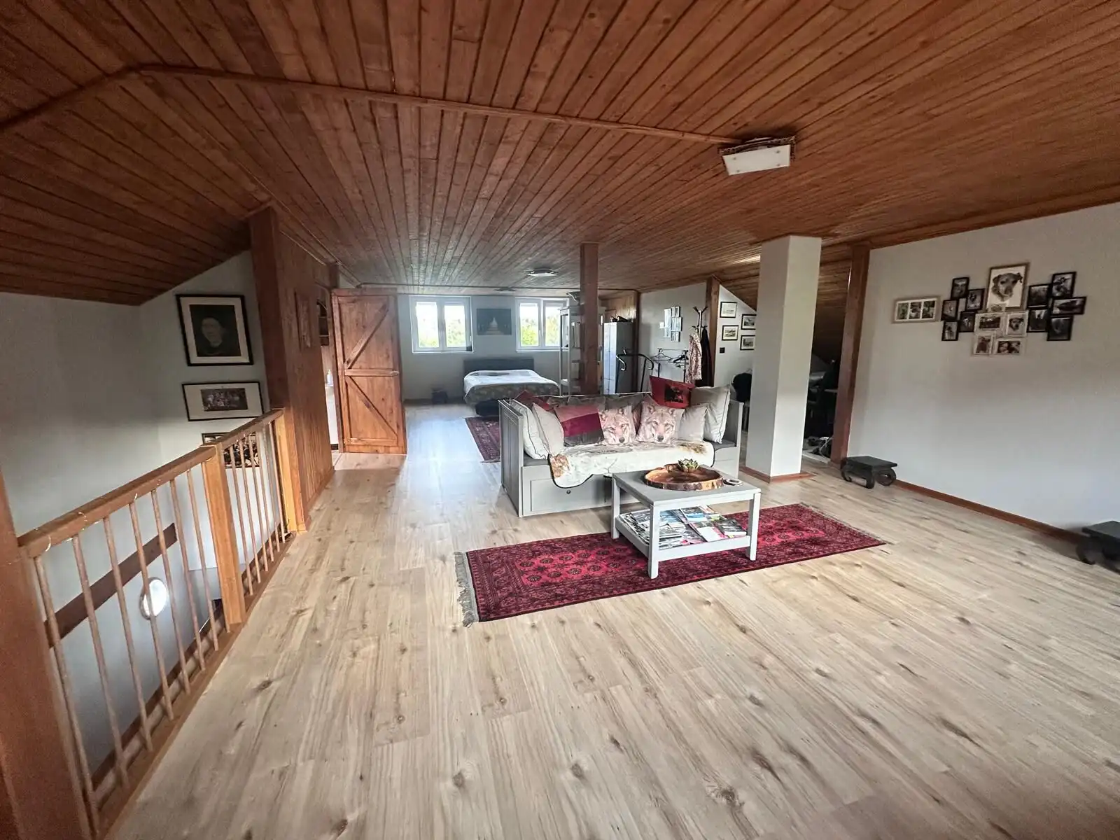 Cozy living room with wooden ceiling and modern furnishings in a beautiful rural home.