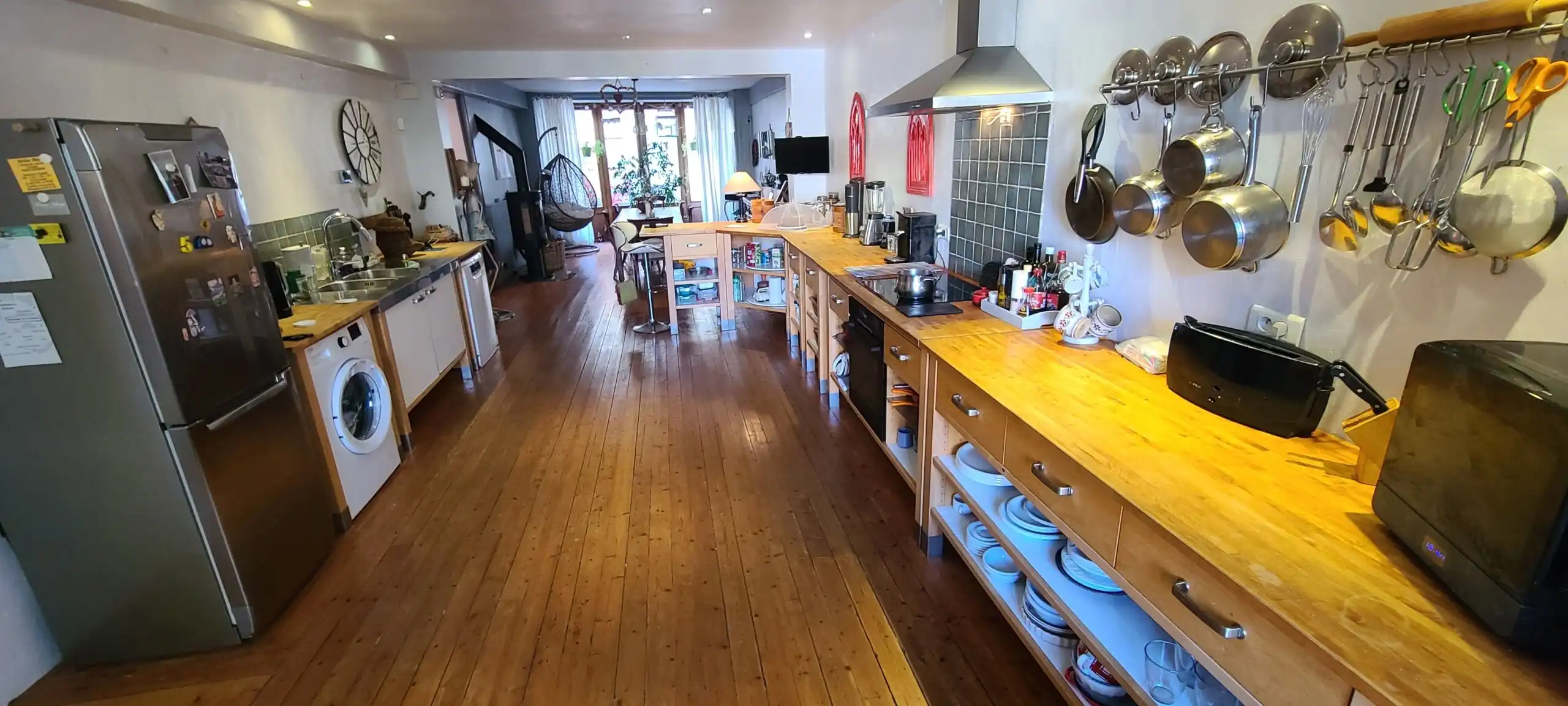 Bright and modern kitchen with ample storage and appliances in a stunning Monségur townhouse. Perfec.