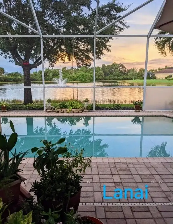 Waterfront villa with pool and scenic lake views in Cape Coral, Florida. Perfect for luxury living a.