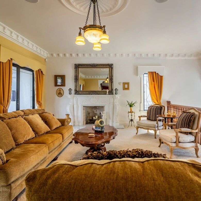 Luxury Château Te Kamo living room with classic decor and spacious seating area.