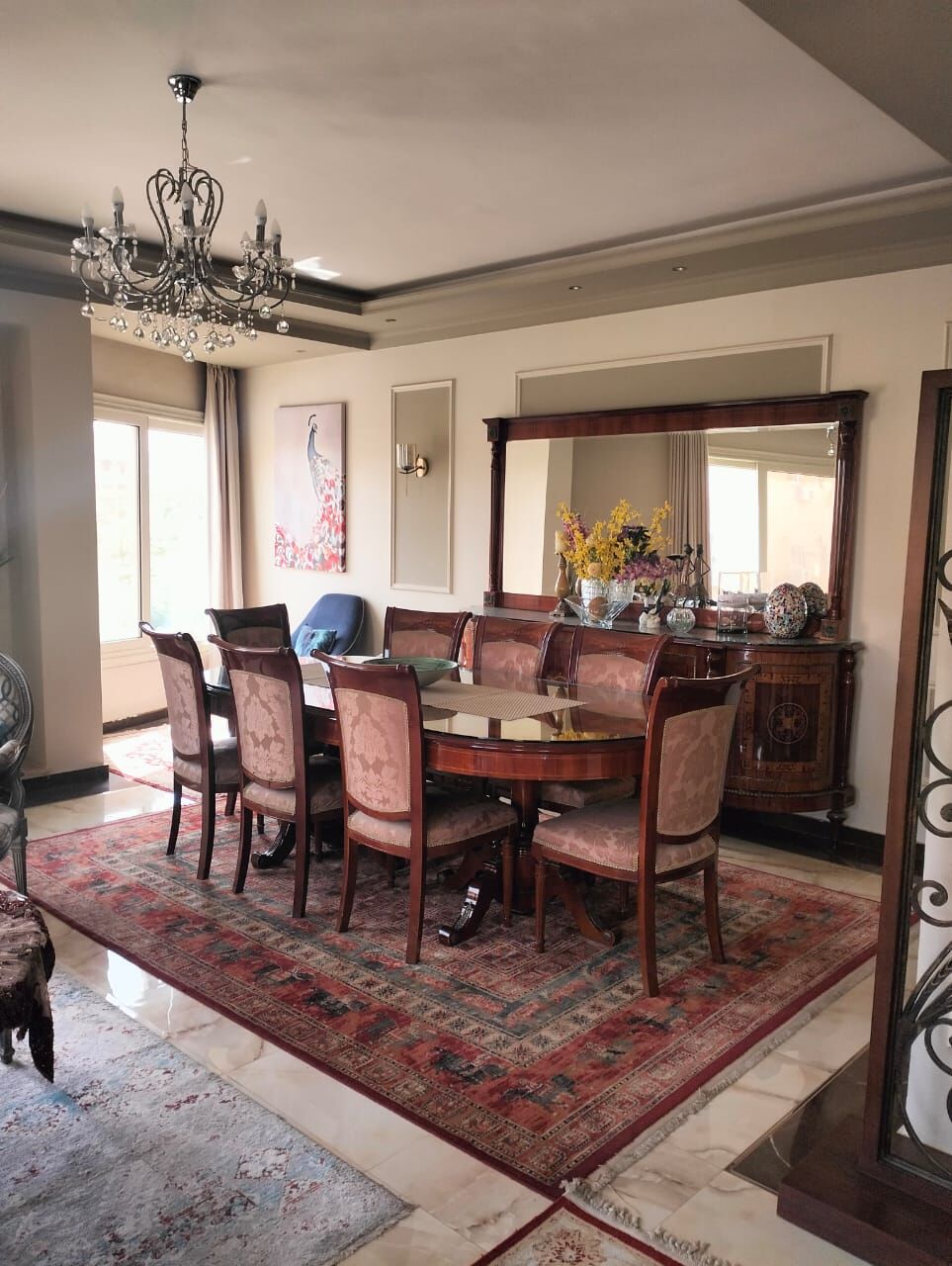 Elegant dining room in a luxury 3-bedroom apartment in New Cairo.