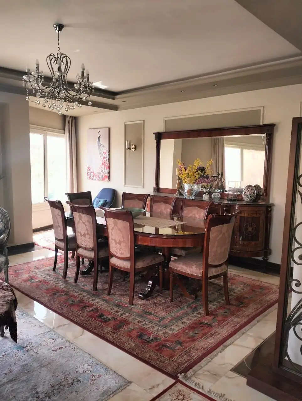 Elegant dining room in a luxury 3-bedroom apartment in New Cairo.