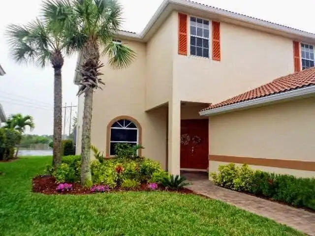 Waterfront luxury 3-bedroom villa in Cape Coral, Florida, with lush gardens and modern design.