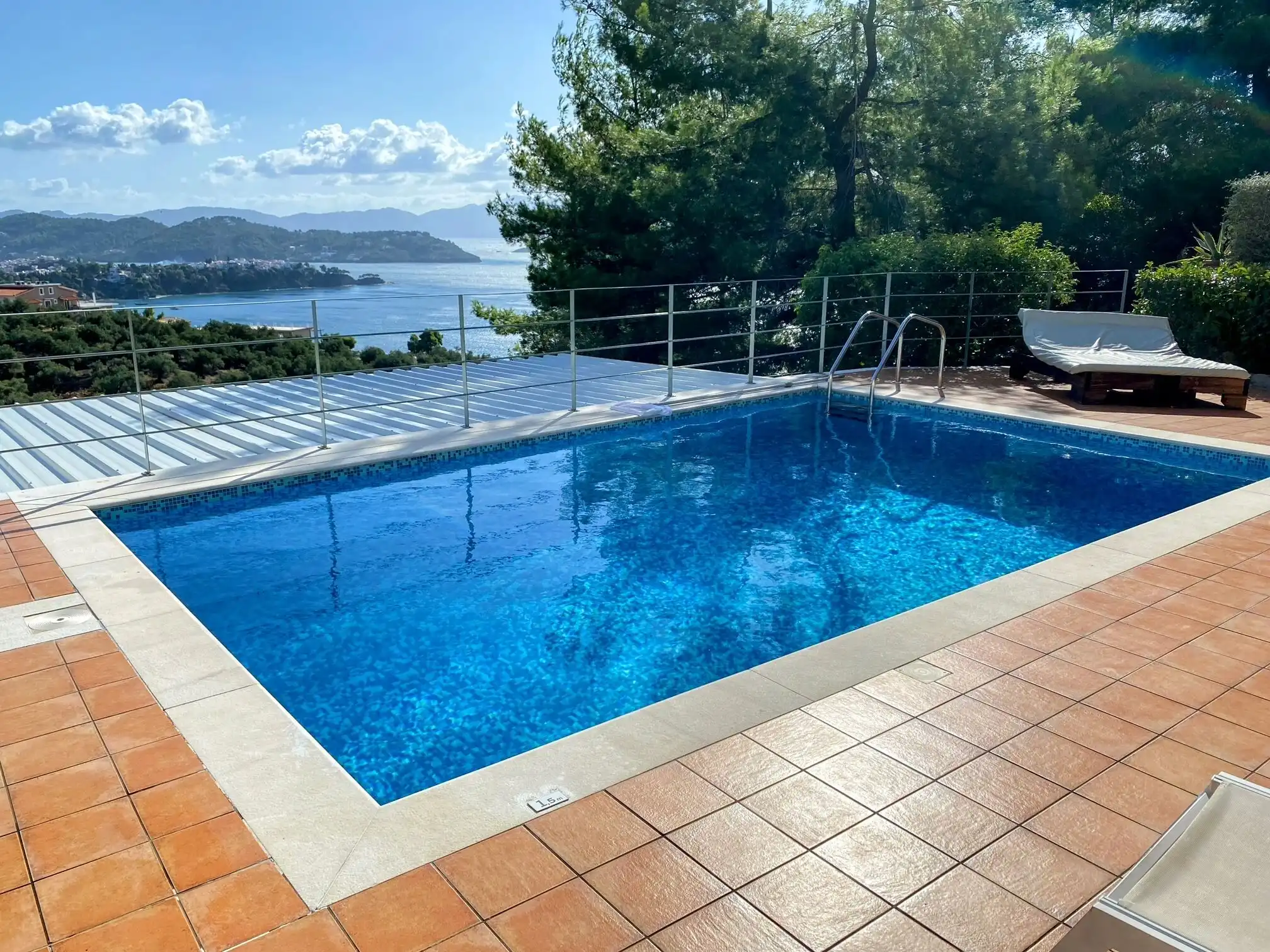 View pool of luxury villa in Skiathos, Greece with scenic landscape.