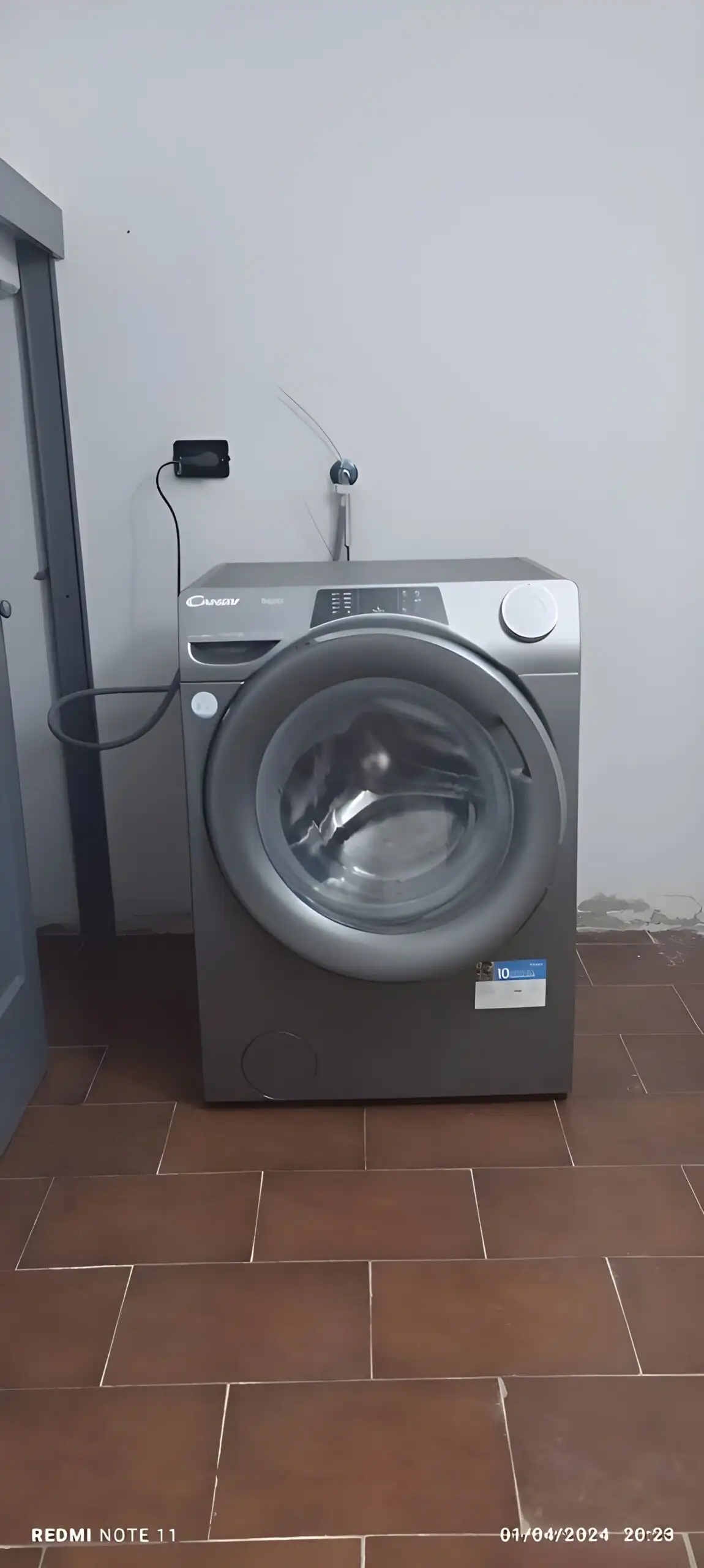 Front-loading washing machine in a minimalist laundry space.