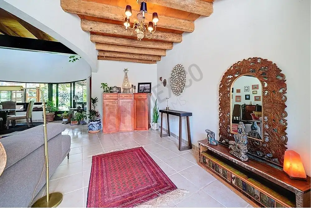 Style living room with wooden ceiling beams and elegant decor.