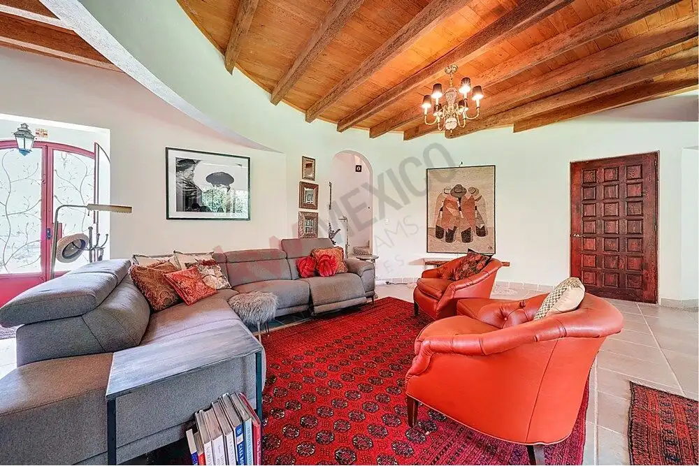 Style living room with wooden ceiling, elegant furniture, and vibrant decor in Rancho Los Labradores.