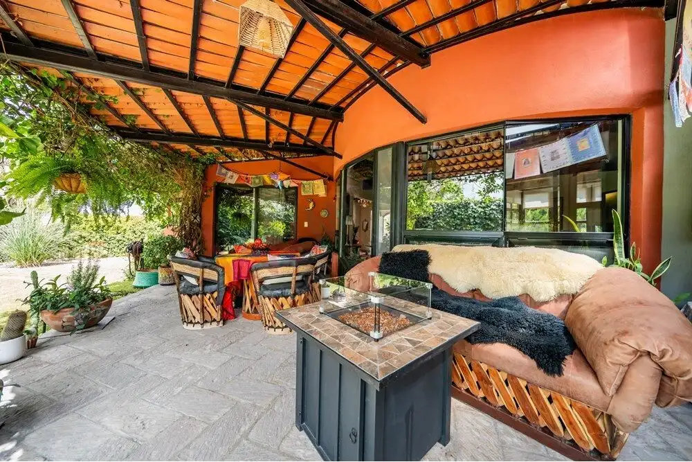 Style patio with cozy seating and lush greenery in Rancho Los Labradores.