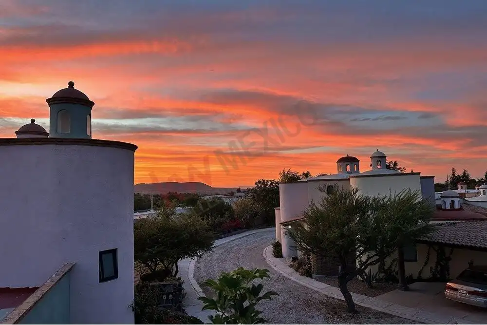 Beautiful colonial home with white walls and curved driveway in Rancho Los Labradores, San Miguel de.