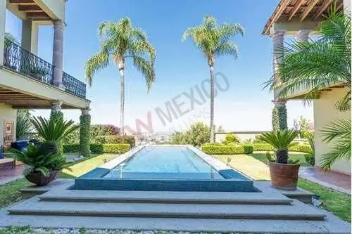 Luxury estate with a stunning pool and lush tropical landscaping in San Miguel de Allende.