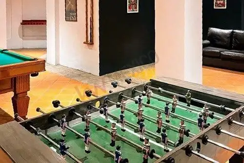 Foosball table in stylish game room of San Miguel de Allende villa.