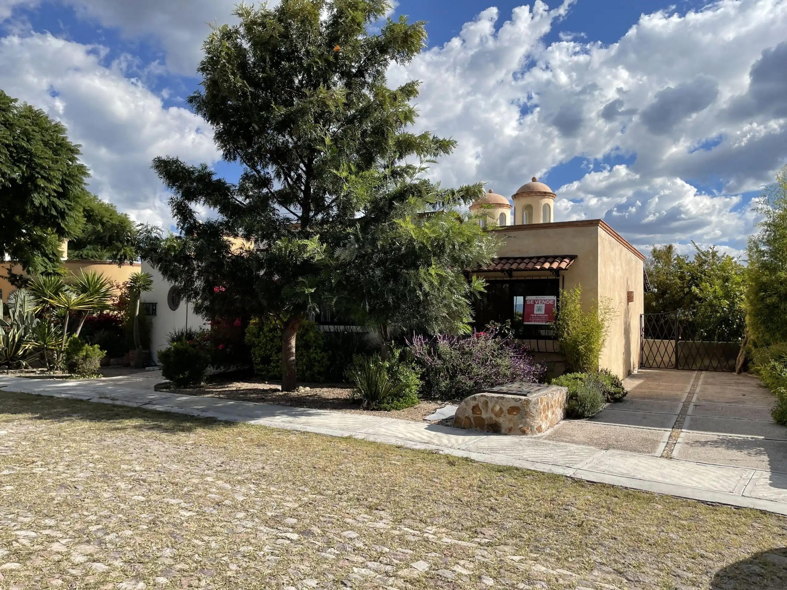 Story home for sale in Rancho Los Labradores, San Miguel de Allende, featuring lush gardens and clas.
