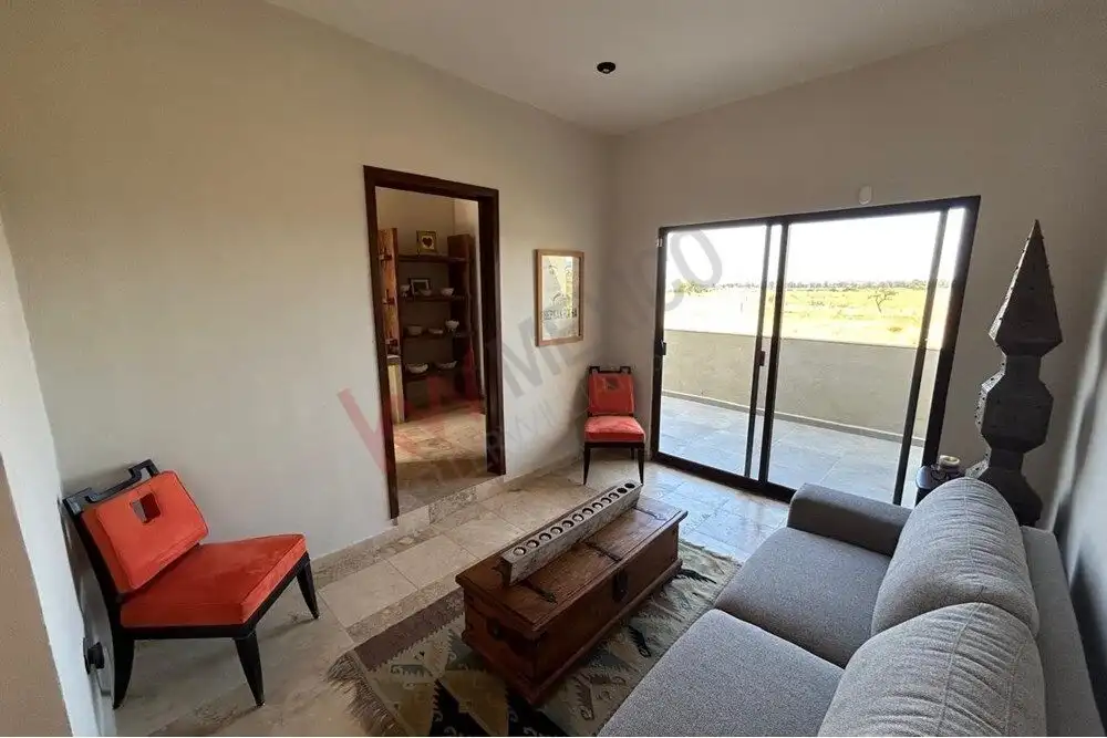 Luxury Country Estate Living Room Elegant living room with modern furnishings and large glass doors in San Miguel de Allende.