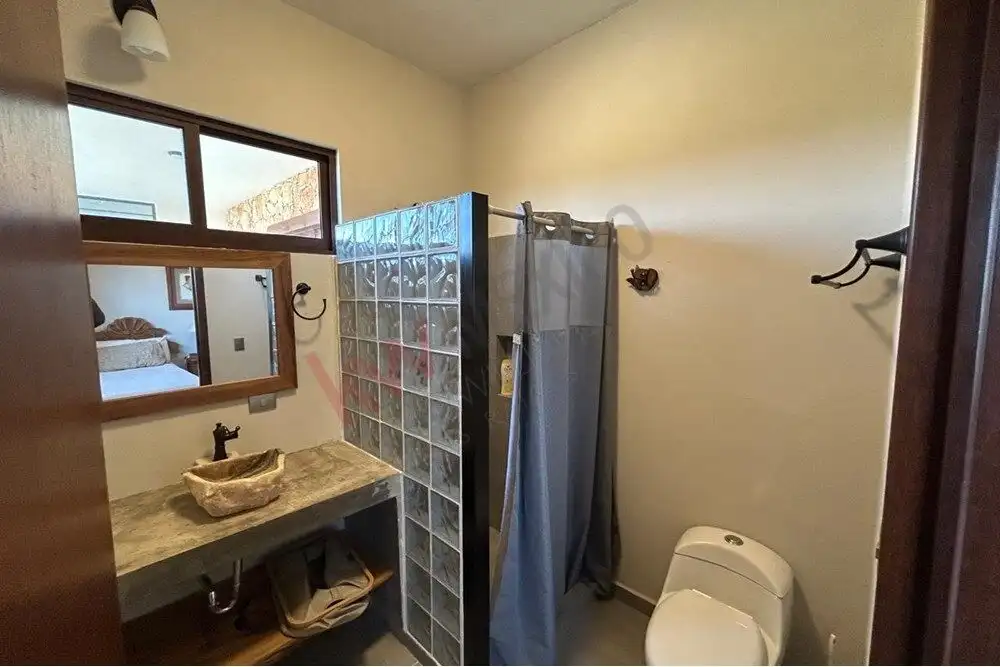 Luxury Country Estate for Sale in San Miguel de Allende Elegant bathroom with rustic stone sink and modern fixtures in San Miguel de Allende estate.