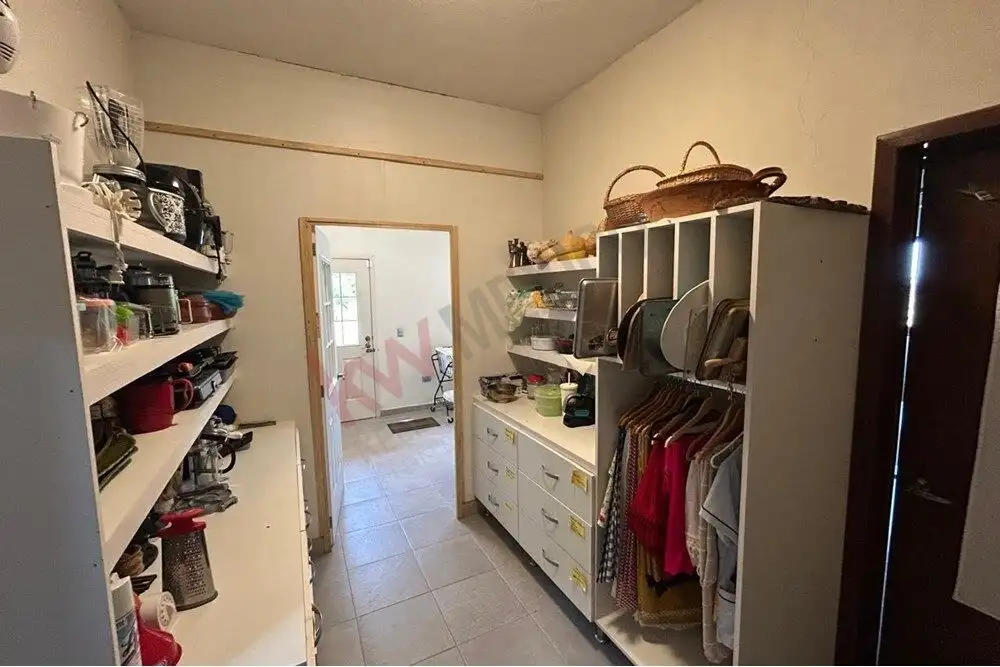 Cozy Pantry Storage in San Miguel de Allende Pantry storage with shelves and cabinets in a luxury estate in San Miguel de Allende.