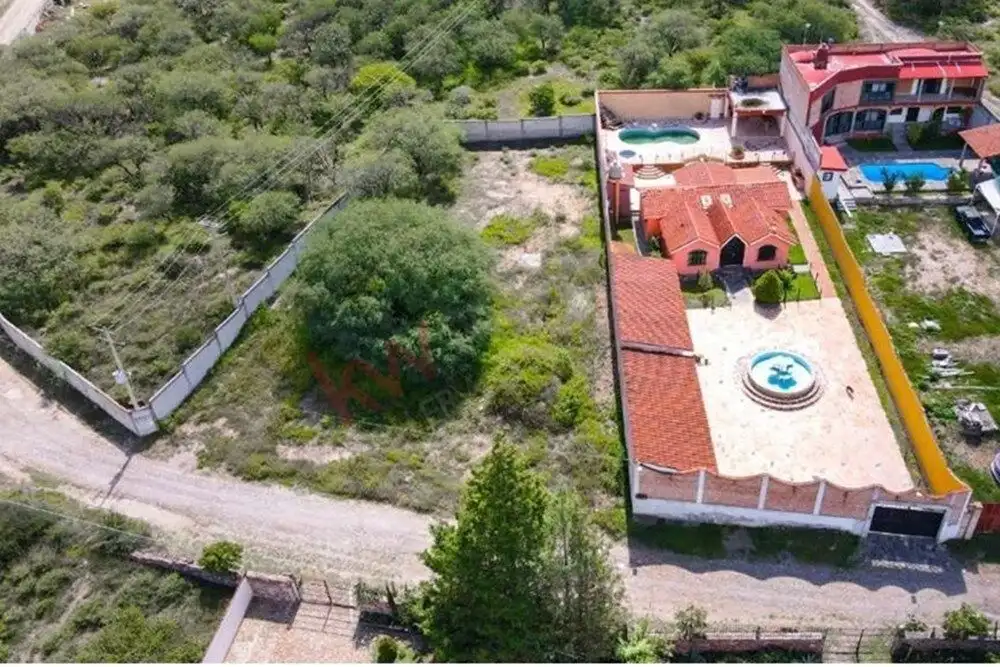 Aerial view of Casa Rincón del Cielo showcasing its private hot spring pool and spacious outdoor are.