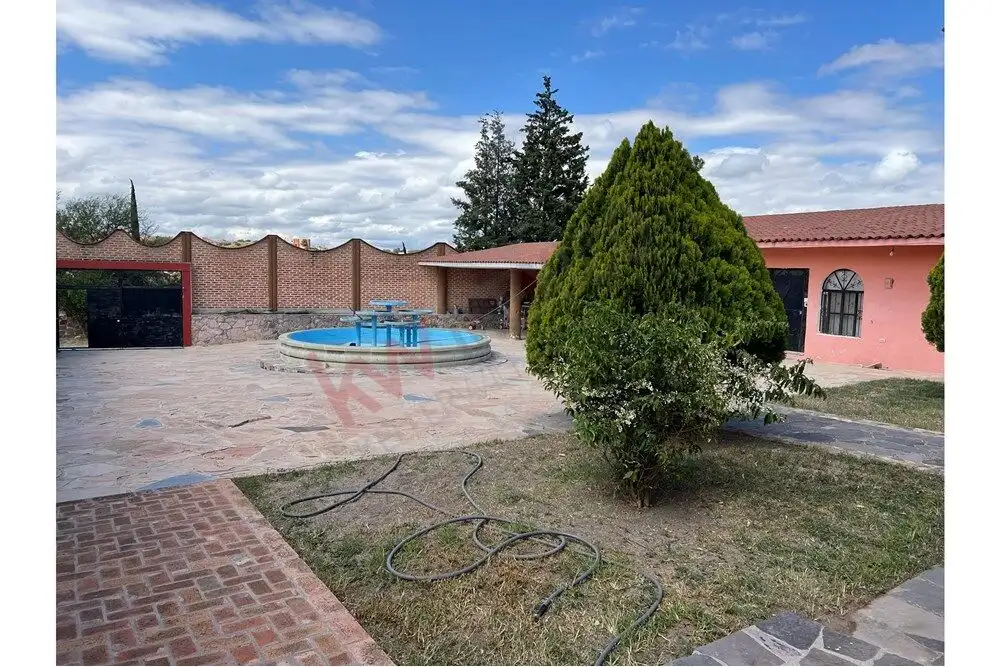 Beautiful countryside home featuring a relaxing hot spring pool and lush greenery. Perfect for peace.
