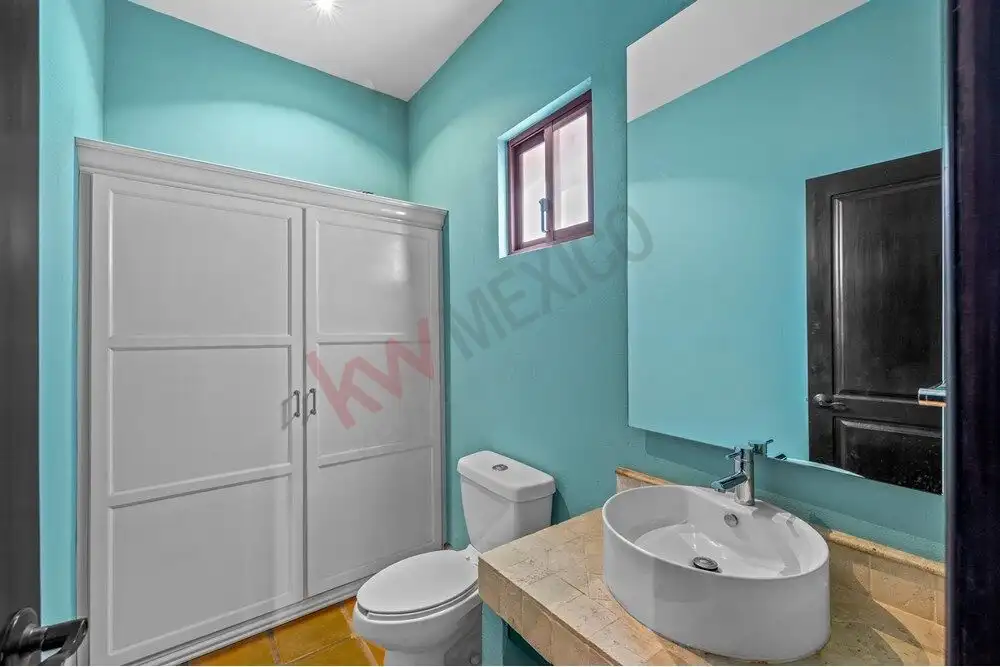 Bright bathroom with modern fixtures in Capilla de Piedra home.