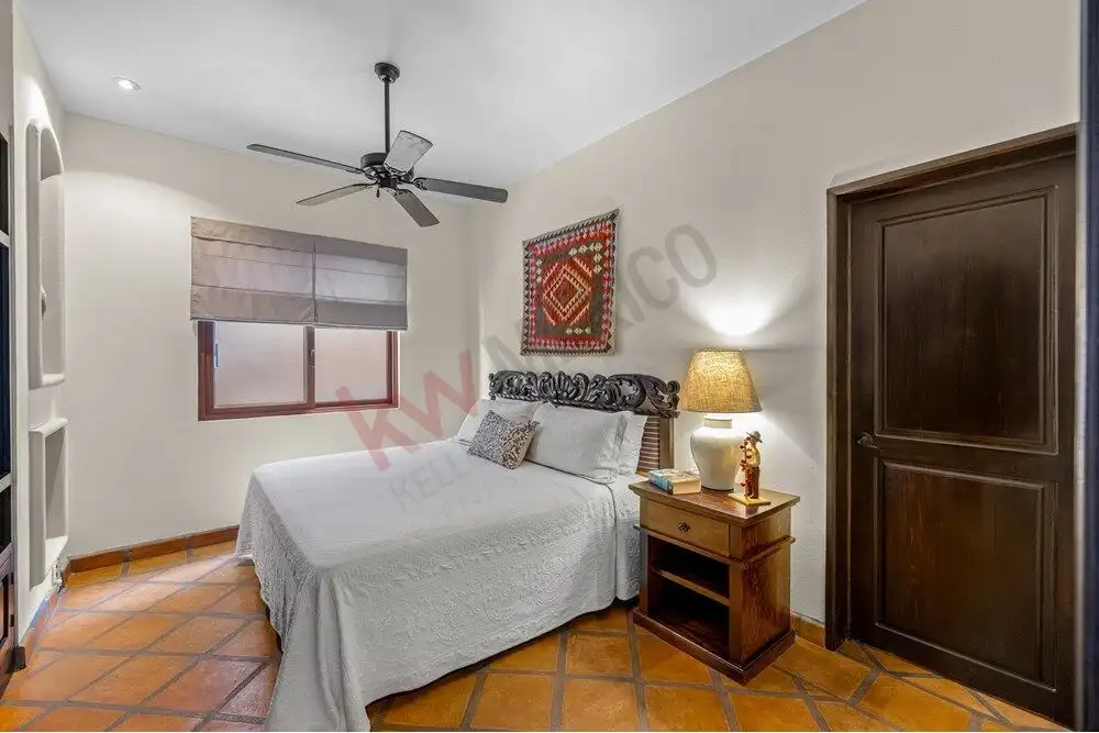 Bright bedroom with modern decor in a remodeled single-level home in Capilla de Piedra.
