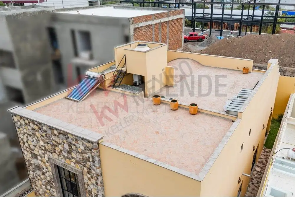 Style 4-Bedroom Home for Sale Modern rooftop terrace with solar panels and outdoor seating.
