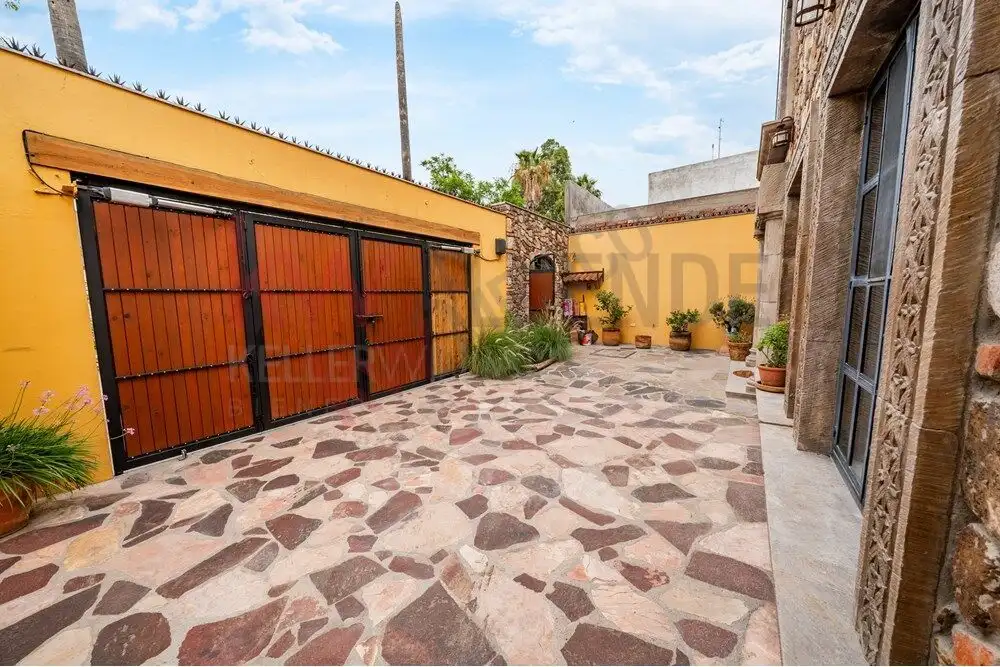 Charming San Miguel de Allende Courtyard Beautiful stone-paved courtyard of a colonial-style home in San Miguel de Allende.