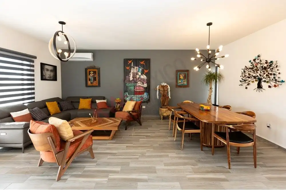 Spacious living area featuring contemporary decor, cozy seating, and elegant lighting fixtures.