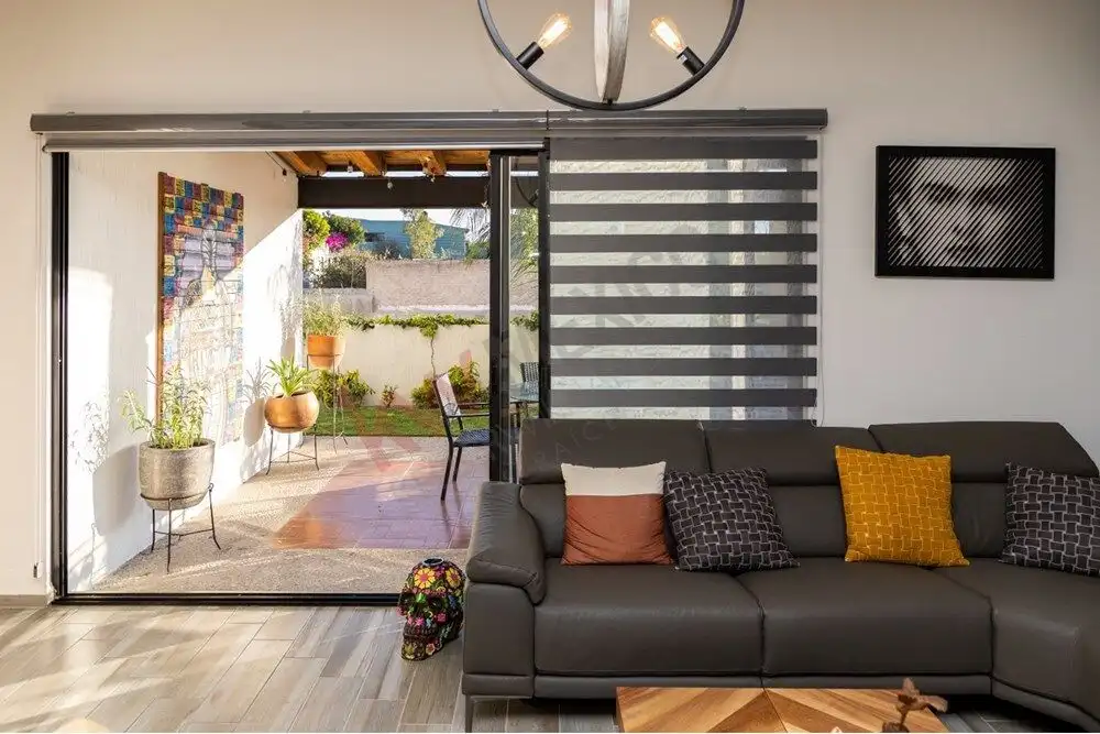 Elegant living room with sliding glass doors opening to a terrace.