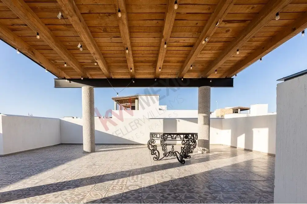 Rooftop terrace with wooden ceiling, open space, and scenic views in San Miguel de Allende.
