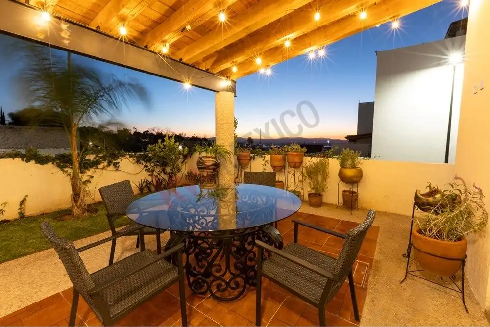Rooftop terrace with seating and potted plants in a luxury home in La Condesa.