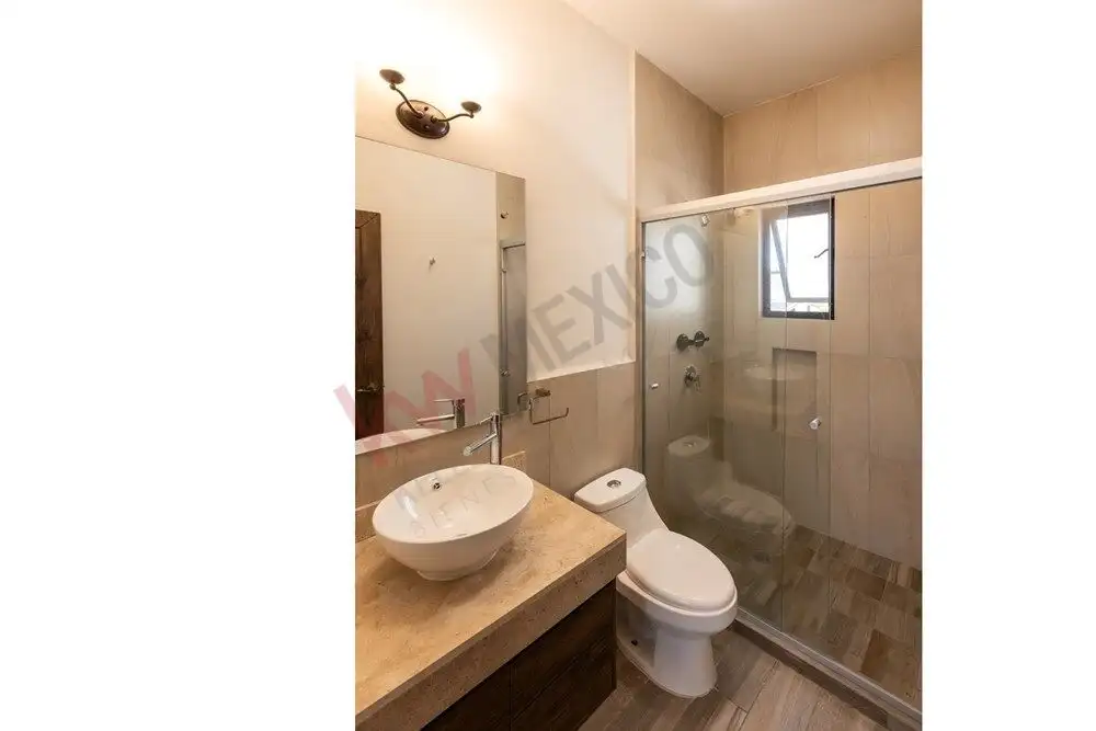 Bathroom with shower and contemporary fixtures in La Condesa luxury home.