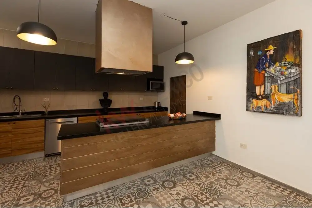 Elegant kitchen featuring modern design, sleek cabinetry, and functional appliances.