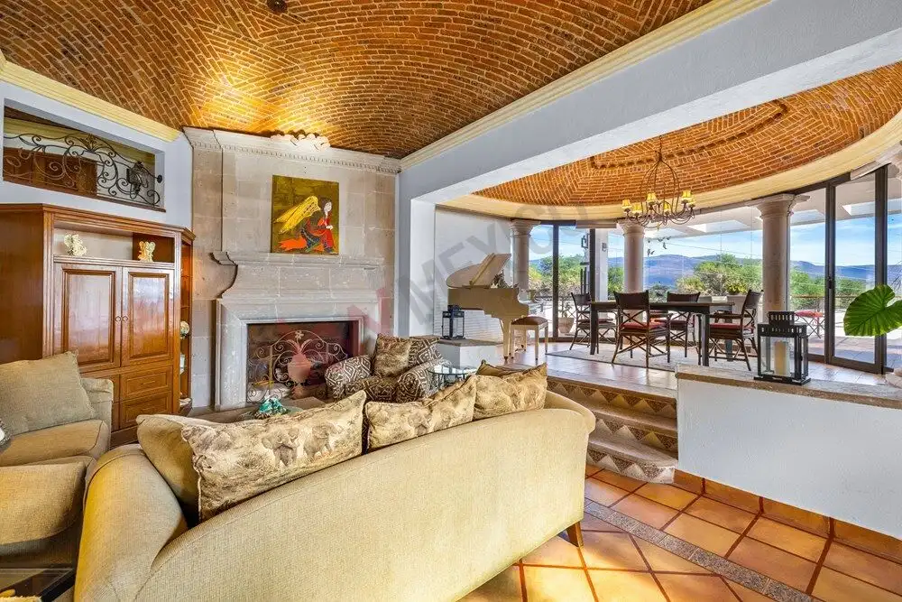 Style living room with panoramic windows overlooking scenic landscapes in San Miguel de Allende.