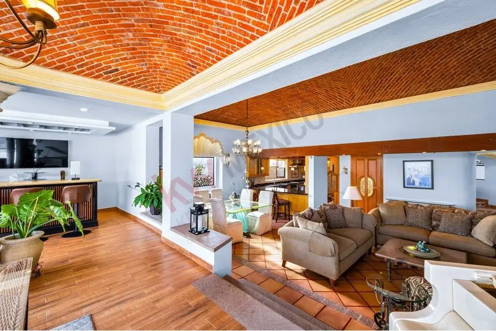 Spacious living room with elegant colonial architecture and panoramic views in San Miguel de Allende.
