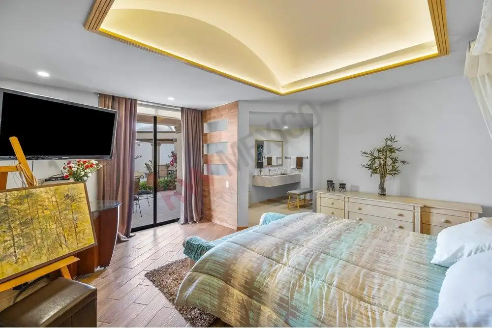 Elegant bedroom featuring panoramic views and colonial decor in San Miguel de Allende. Perfect for a.