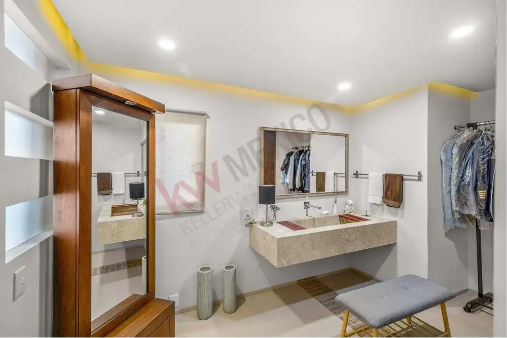 Elegant bathroom featuring contemporary design, spacious vanity, and panoramic views in a luxury San.