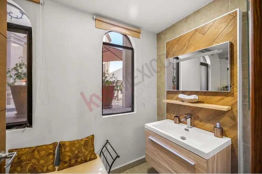 Elegant bathroom with modern fixtures and panoramic views in San Miguel de Allende.
