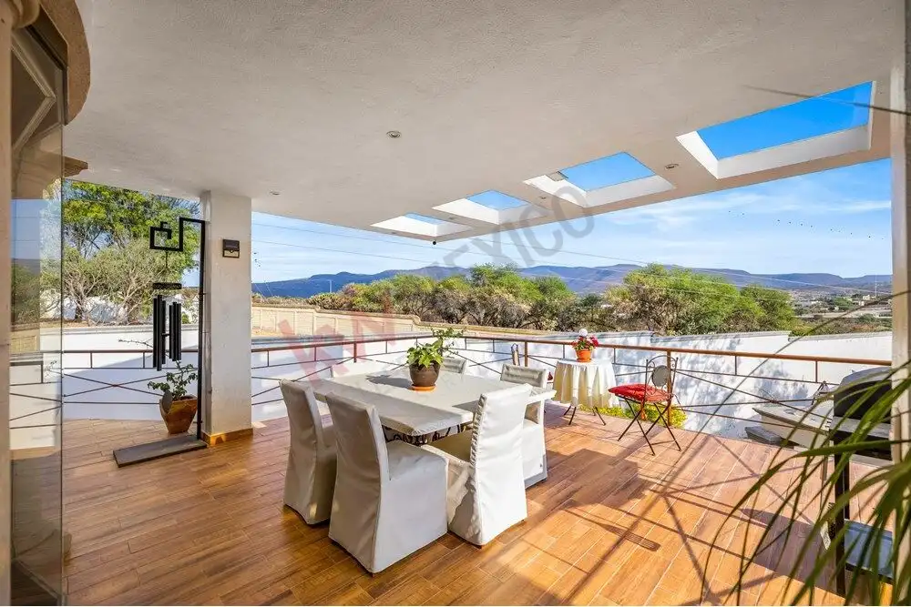 Balcony of a luxury colonial home overlooking scenic landscape and rolling hills. Bright, spacious o.